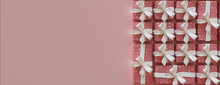 Romantic Wallpaper With Valentine's Day Gifts Precisely Arranged In A Grid. Cute Pink And White Banner With Copy-space.