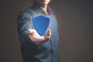 Man clicking on viral screen with shield, protection concept