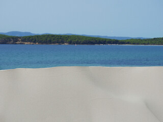 Wall Mural - Sand dunes at the background of the sea in Sardinia in Porto Pino