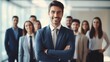 © Olive Studio - A charismatic business leader standing ahead of his cheerful team in a corporate office environment  AI generated