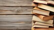Pile of aged books on a rustic wooden table
