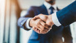 © Your Hand Please - Professional handshake between businessmen symbolizing agreement and partnership in a corporate setting