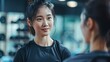 © MdKamrul - Young korean woman working with trainer at gym