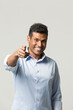 © Image Smith - Happy Indian man pointing his finger