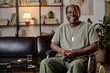 © AnnaStills - Mature african american war veteran with disability posing at therapist office smiling at camera