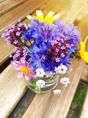 Wall Mural - bouquet of flowers on a wooden table