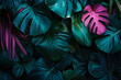Tropical leaves in neon light, abstract background