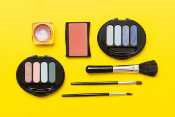 Wall Mural - Professional makeup tools. Top view. Flat lay. Beauty, decorative cosmetics. Makeup brushes set and color eyeshadow palette on table background. Minimalistic style