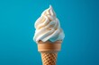 © Darya Lavinskaya - Delicious creamy white vanilla ice cream cone on a blue background