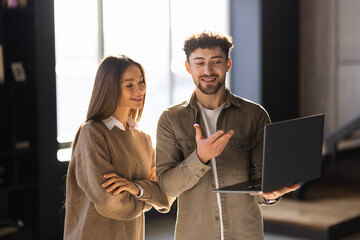 Wall Mural - Modern business people working on laptop in office