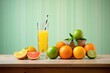 a set of actual citrus fruits beside a tall glass of juice
