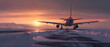 Airplane landing at the airport runway at arctic sunset in winter afternoon