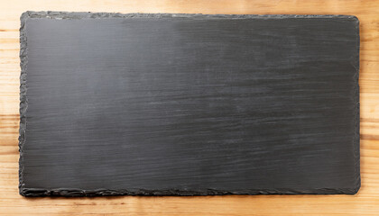 Wall Mural - black slate board for serving with copy space, top view; menu concept; isolated on wooden