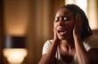 upset black woman screaming and crying indoors at home. shock and emotional breakdown, depression.