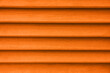 Leinwandbild Motiv Texture of orange wooden planks as background, closeup