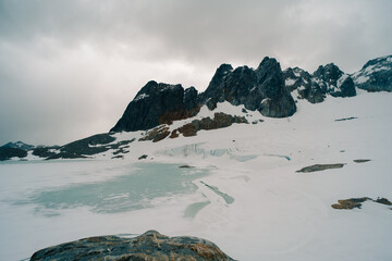 Ojo del Albino glacier and lake located in the hiking trail in Tierra Mayor valley, Tierra del Fuego, Argentina