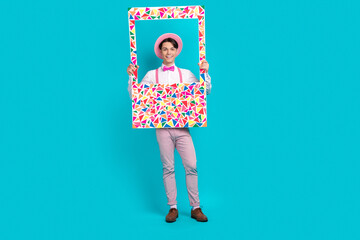 Sticker - Full body photo of optimistic guy wear white shirt pink headwear bow tie holding frame make picture isolated on blue color background