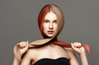 © Beauty Agent Studio - Hair care. Hair cut.Beautiful young woman with long healthy hair posing against grey background. Beauty salon concept