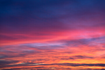 Wall Mural - glowing real sky at sunset texture background overlay. dramatic red and orange clouds.