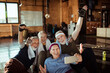 © Davor - Happy excited senior people taking group photo in gym