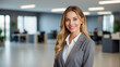 © Jacks Studio - An executive assistant manager blond hair woman in the office, grey suit, professional business people