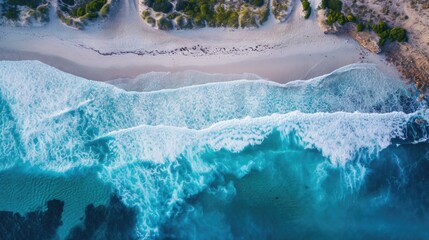 Wall Mural - Turquoise water with wave with sand beach background rocks and corals from aerial top view in sunset. Concept summer