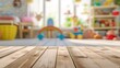 Wooden table on blurred background of children's playroom with toys. Display of products.