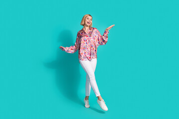 Sticker - Full size photo of positive cheerful girl wear oversize shirt white trousers show stylish shoes isolated on turquoise color background