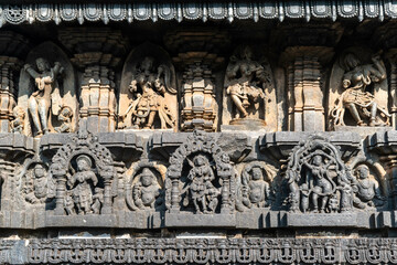 Sticker - Beautiful intricate patterns and carvings of figurines on the wall of the ancient Chennakeshava temple in Belur, Karnataka.