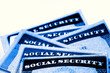 © Lane Erickson - Social Security Cards in a Row Pile for Retirement blue color