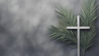 Christian cross and green palm leaf. Gray background. Holy week. Palm Sunday.
