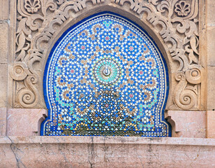 Wall Mural - Moroccan style fountain with fine colorful mosaic tiles at the Mohammed V mausoleum in Rabat Morocco