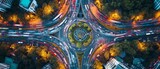 Fototapeta  - Birds Eye View Of Busy Highways And Roundabouts Showcasing Bustling Car Traffic. Сoncept Cityscape Aerial Photography, Busy Highway Traffic, Roundabout Intersection, Urban Hustle And Bustle