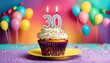 Birthday cupcake with burning lit candle with number 30. Number thirty for thirty years or thirtieth anniversary.