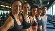 group of smiling fitness people in the gym