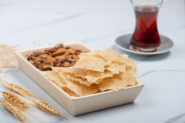 Tarhana chips, Turkish snack made with flour, wheat berries, mint, yogurt and spices also known as frik