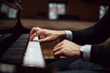 Fototapeta Przestrzenne - Hands of a pianist playing piano