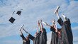 © Довидович Михаил - Happy college graduates tossing their caps up at sunset.