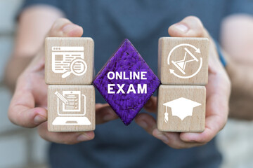 Man holding blocks sees text: ONLINE EXAM. Online exam concept, choose correct answer in test. E-learning, education, online testing concept. On-line questionnaire results.