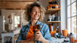 © Studio Nova - Cheerful woman holding a cordless drill, standing in a well-organized workshop filled with various tools.
