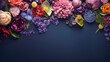 scattered spring flowers on dark blue color background, top view with copy space