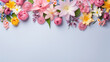 spring flowers on a blue background, top view with copy space