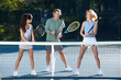 © joescarnici - Tennis Players warm up before a tennis match in the afternoon