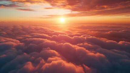 Wall Mural - Beautiful sunset cloudy sky from aerial view. Airplane view above clouds