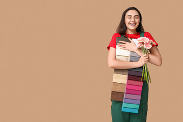 Sticker - Portrait of young female painter with color palettes and bouquet of flowers on beige background. International Women's Day