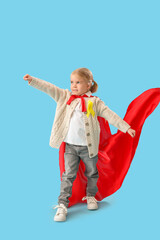 Sticker - Cute little girl in superhero costume with yellow ribbon on blue background. Childhood cancer awareness concept