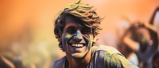 Wall Mural - happy man enjoying a holi festival with colorful paint and his face smeared