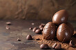 Chocolate Easter eggs and cocoa powder on a brown background. Copy space.