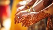 Closeup of delicate, handpainted henna designs adorning festivalgoers hands.