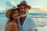 Fototapeta Do akwarium - a happy senior couple enjoy their holiday at the beach
